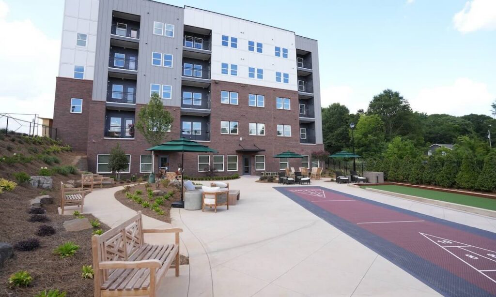 Park Place apartment building and landscaped courtyard with shuffleboard