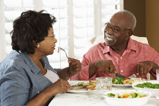 Older couple sharing a meal at home