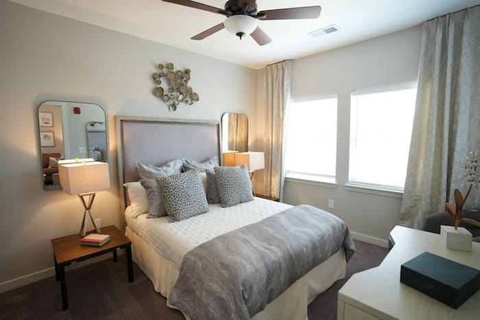 Avonlea bedroom with bed and two windows